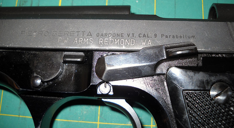 detail, Beretta 92S slide markings, left side: PIETRO BERETTA GARDONE V.T. CAL. 9 Parabellum - PW ARMS REDMOND WA